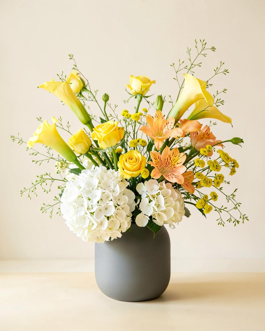 Finished modern asymmetric arrangement in a ceramic vase